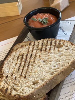 Tostada - simple Spanish pulped tomato breakfast, and you add the salt and olive oil as preferred   at Manuka - Plaza del Mar in Marbella