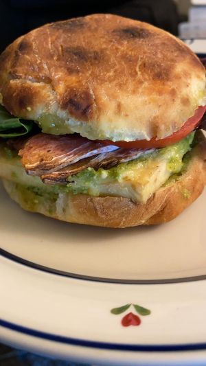 Pesto breakfast sandwich - bacon added. I am a complete fiend for this! at Cafe Red in Seattle
