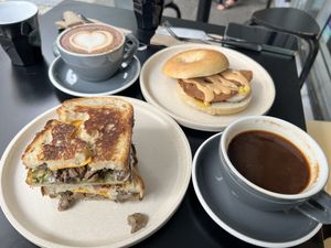 My Shroom Toastie, Vegan Bacon and Eggs Bagel, cappuccino, coffee   at Shift Eatery in Surry Hills