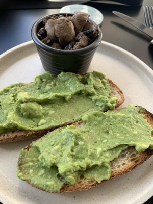 Avocado toast with a side of roasted mushroom. Super delicious!  at Shift Eatery in Surry Hills