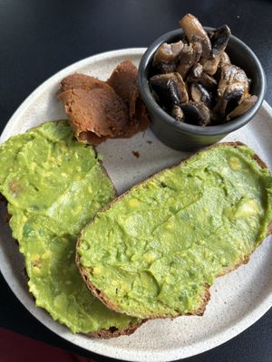 Avo toast with house bacon and mushrooms   at Shift Eatery in Surry Hills