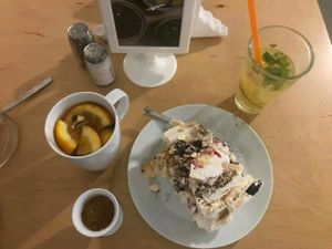 ";Hot ginger"; (10zl), lemonade (6zl) and non-vegan cake (12zl) at Big Book Cafe in Warsaw