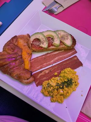 Brunch option 2, ham and cheese croissant, vacon, avo toast with tomato and tofu eggs at Freedom Cakes Bakery in Madrid