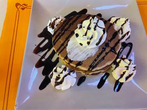 Pancakes with chocolate syrup   at Freedom Cakes Bakery in Madrid