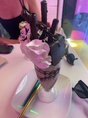 Death by Freakshake (Chocolate Milkshake with whipped cream, a piece of chocolate cake, and a chocolate-covered cookie on top) at Freedom Cakes Bakery in Madrid