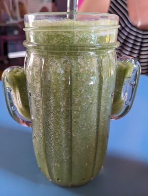 Green Power Smoothie in a fun glass at Freedom Cakes Bakery in Madrid