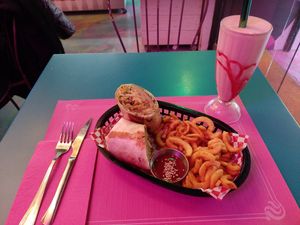 Kebab, curly fries and strawberry milkshake at Freedom Cakes Bakery in Madrid
