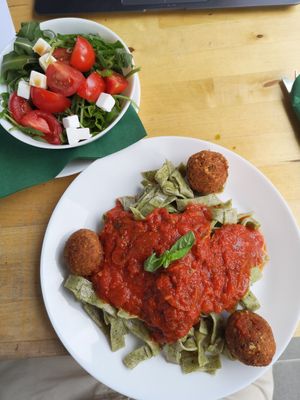 Spaghetti with balls and tomatosauce. Salad on the side at Simple Green in Zagreb