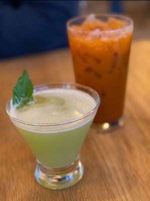 The Gardener's Delight gin cocktail & Thai iced tea at Kati Vegan Thai in Seattle