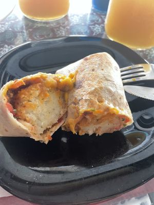 Vegan burrito with rosemary & garlic tots and a mango/maracuja agua fresca.  at Papa Tots in Puerto Escondido