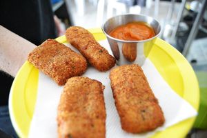 Cheese sticks made with a local Oaxacan cheese, seasoned breadcrumbs and served with homemade marinara sauce. at Papa Tots in Puerto Escondido