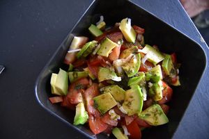 Fresca salad comes with tomato, avocado and green onion with a basil oil and balsamic vinegar at Papa Tots in Puerto Escondido