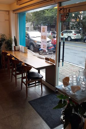 Interior of location, view towards the entrance and some seating at Soiroum in Seoul