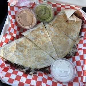 asada quesadilla with chipotle mayo, avocado salsa, and sour creamm  at El Cocinero Restaurant in Van Nuys