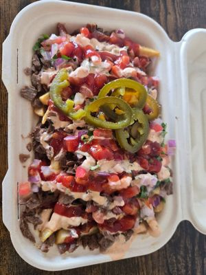 Loaded fries 🍟 I asked for no mustard & easy on the jalapeños at El Cocinero Restaurant in Van Nuys