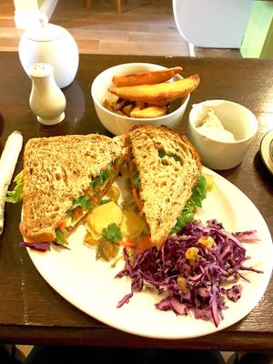 Vegan ploughmans sandwich with wedges at Crocus Cafe in Nottingham