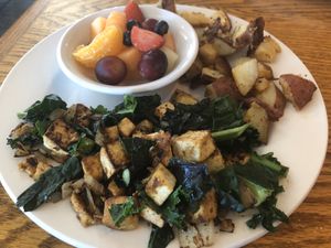 Tofu scramble with Kale and onions, and a side of potatoes and fruit  at Bentley's House of Coffee & Tea in Tucson