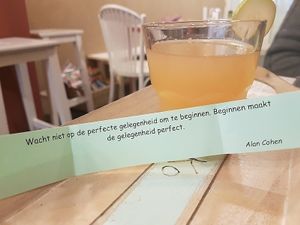 saying on paper with drinks at T&Ko in Leuven