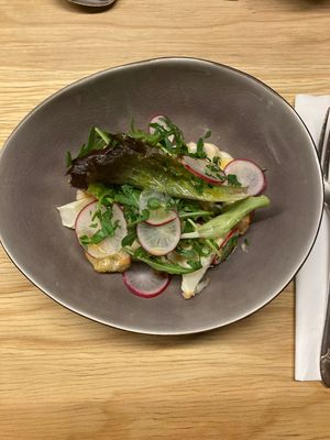 1st course: cauliflower, raisins, capers, salad and radishes accompanied by a cheesy dressing  at Oscar Kocht in Innsbruck