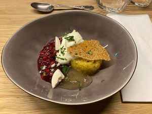 6th course: safran rice pudding with sour cherries, sesame and yuzu jelly  at Oscar Kocht in Innsbruck