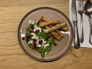2nd course: carrots wrapped in puff pastry with hummus, pomegranate and feta   at Oscar Kocht in Innsbruck