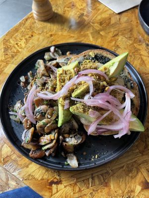Avocado toast with mushrooms  at Grown in West End