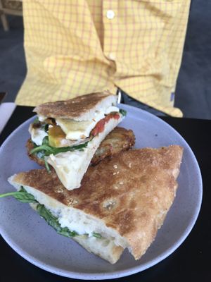 Toasted sandwich with hash brown  at Grown in West End