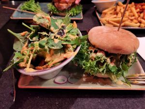 Delicious burger on sourdough bun with avocado loaded fries at Hans im Glück in Muenster