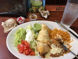 burrito covered in cheese at Taqueria Los Mayas in Cheektowaga