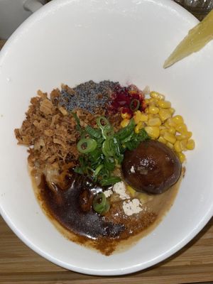 White garlic and red chili pepper Ramen (can’t see the noodles under the spices and sauce)   at Men Impossible in Amsterdam
