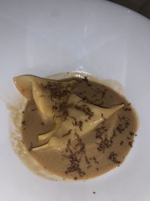 "parmesan" filled pasta pillows with miso sauce and truffle shavings at Gauthier Soho in London