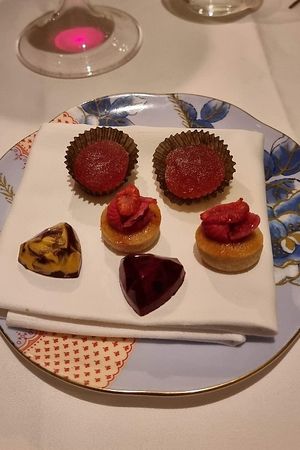 Mini raspberry tarts, pâte de fruits, passion fruit and caramel bonbons at Gauthier Soho in London
