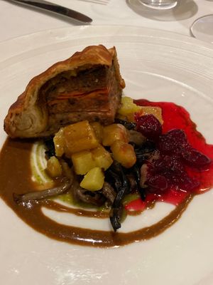 Christmas pathivier with with turnip, mushrooms and cranberries with a red wine jus and parsley sauce.  at Gauthier Soho in London