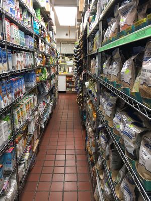 Cramped but full aisles of store at The Health Nuts Deli - East Side Midtown in New York City