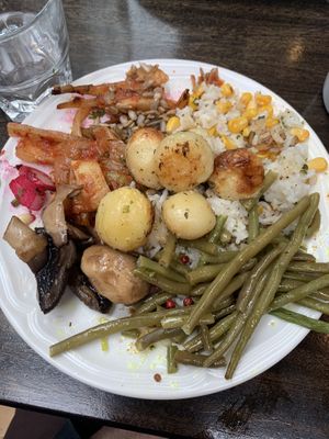 String beans, really good mushrooms, rice and corn, potatoes, and a sunflower seed dish that I liked, all from the buffet  at The Settlement Center Restaurant in Borgarnes