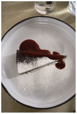 Dessert: Chokolate Tarte with a shot of raspberry  at Gaudi&Naan in Ljubljana