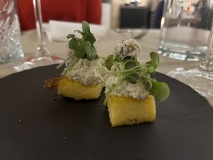 Baked polenta, cheese, sourdough   at Gaudi&Naan in Ljubljana