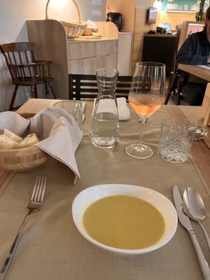 Vegetable soup, bread and rosé wine   at Gaudi&Naan in Ljubljana