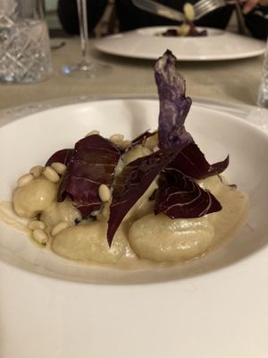 Homemade gnocci with nooch cream, pinenuts and radicchio.  at Gaudi&Naan in Ljubljana