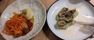 Stuffed cabbage (left) gnochis with truffle cream (half eaten) at Gaudi&Naan in Ljubljana