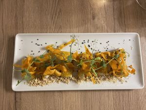 Cured bell pepper filled with cream and topped with crispy carrot or potato  at Gaudi&Naan in Ljubljana