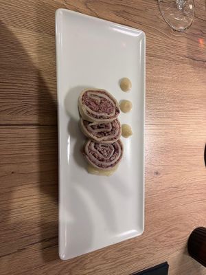 Struklji - a traditional Slovenian dish veganified. A bean paste wrapped in dough with onion puree and sauerkraut at Gaudi&Naan in Ljubljana