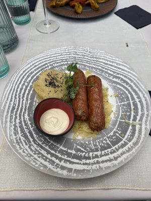 Sausage and sour cabbage  at Gaudi&Naan in Ljubljana