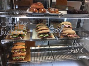 Half filled as she was still unpacking - fresh sandwiches, cream donuts etc at Tart Bakery - St Kevins Arcade in Auckland