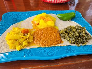 Cabbage, collard greens potatoes and spicy lentils with jalapeno pepper at Amy's Ethiopian in Nashville