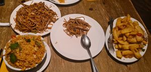 Left top: chow mein; left bottom: chicken Singapore rice; right: chilli pepper chips at Oriental Aroma in Royal Wootton Bassett