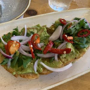 Avocado toast with SPICY peppers! at Everly in Madison