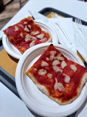 Two pieces of pizza at Oasi Verde in Siena