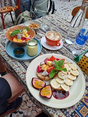 Vegan granola and Toast with almond butter and fruit at Nook Eatery in Hue