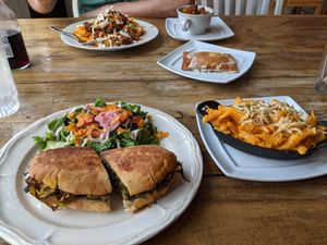 Clockwise from to left: supreme Mac & cheezy, home fries, pop tart, buffalo Mac and cheese, and southside Cubano with side salad at Two Dollar Radio Headquarters in Columbus